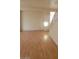 Bright living room featuring neutral walls and pristine hardwood floors at 8149 Palace Monaco Ave, Las Vegas, NV 89117