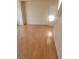Bright living room featuring neutral walls and pristine hardwood floors at 8149 Palace Monaco Ave, Las Vegas, NV 89117
