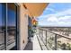 Relax on this covered balcony with views of the city and mountains in the distance at 8255 Las Vegas Blvd # 1219, Las Vegas, NV 89123