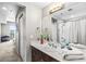 Bathroom showing a sink, vanity with modern fixtures and a view into the shower and beyond at 8255 Las Vegas Blvd # 1219, Las Vegas, NV 89123