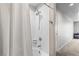Clean bathroom with a shower-tub combination and a view of the hallway and bedroom beyond at 8255 Las Vegas Blvd # 1219, Las Vegas, NV 89123