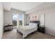 Bright bedroom featuring neutral tones, a comfortable bed, and balcony access at 8255 Las Vegas Blvd # 1219, Las Vegas, NV 89123