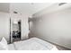 Neutral bedroom showcasing an open closet with ample storage, next to a bed with white bedding at 8255 Las Vegas Blvd # 1219, Las Vegas, NV 89123