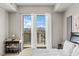 Bright bedroom with sliding glass doors leading to a balcony with mountain views at 8255 Las Vegas Blvd # 1219, Las Vegas, NV 89123