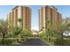 Luxury condo buildings with beautiful landscaping and trees lining the entrance at 8255 Las Vegas Blvd # 1219, Las Vegas, NV 89123