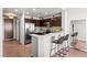 Kitchen featuring bar seating with stainless steel appliances and ample cabinet space at 8255 Las Vegas Blvd # 1219, Las Vegas, NV 89123