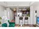 Open floor plan view of living and kitchen area with barstool seating at 8255 Las Vegas Blvd # 1219, Las Vegas, NV 89123