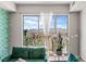 Inviting living room with a stunning view from the balcony and comfortable green couches at 8255 Las Vegas Blvd # 1219, Las Vegas, NV 89123