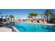 Outdoor swimming pool with multiple cabanas, palm trees, and lounge chairs at 8255 Las Vegas Blvd # 1219, Las Vegas, NV 89123