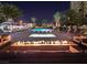 Outdoor pool area with palm trees, cabanas, lounge chairs, and outdoor fireplace at 8255 Las Vegas Blvd # 1219, Las Vegas, NV 89123