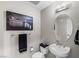 Charming powder room with pedestal sink, oval mirror, and elegant wall decor at 8255 Las Vegas Blvd # 1219, Las Vegas, NV 89123