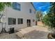 Backyard features a concrete patio surrounded by mature landscaping at 8307 Fort Hallock Ave, Las Vegas, NV 89131