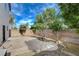 A quaint backyard boasts ample room for outdoor seating and entertainment with a gravel area and small garden at 8307 Fort Hallock Ave, Las Vegas, NV 89131