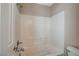 Bright bathroom with a shower and tub combo featuring white tile surround and a toilet at 8307 Fort Hallock Ave, Las Vegas, NV 89131