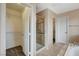Bright bathroom with walk in shower, access to a walk in closet, and a large soaking tub at 8307 Fort Hallock Ave, Las Vegas, NV 89131