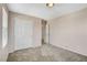 Bedroom features neutral-colored walls, plush carpeting, a closet, and an entry doorway at 8307 Fort Hallock Ave, Las Vegas, NV 89131