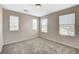 Bright bedroom with three large windows and neutral carpeting throughout at 8307 Fort Hallock Ave, Las Vegas, NV 89131