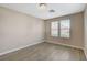 Cozy bedroom with two windows offering natural light and wood-style flooring at 8307 Fort Hallock Ave, Las Vegas, NV 89131