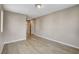 Empty bedroom showcasing wood-style floors and an attached bathroom at 8307 Fort Hallock Ave, Las Vegas, NV 89131