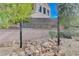 Beautiful community sign in a rock garden setting with trees in the background at Trailwood at Tulle Springs at 8307 Fort Hallock Ave, Las Vegas, NV 89131