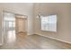 Dining area with tall ceilings, chandelier lighting, and wood-look flooring at 8307 Fort Hallock Ave, Las Vegas, NV 89131