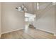 Dining area with tall ceilings, staircase to second story, and wood-look flooring at 8307 Fort Hallock Ave, Las Vegas, NV 89131