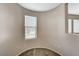Hallway with a beige wall and carpet flooring with a view of the neighborhood from the window at 8307 Fort Hallock Ave, Las Vegas, NV 89131