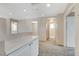 Spacious hallway with neutral walls, plush carpeting, recessed lighting, and multiple entryways at 8307 Fort Hallock Ave, Las Vegas, NV 89131