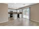 Modern kitchen with white cabinets, stainless steel appliances, and a sliding glass door at 8307 Fort Hallock Ave, Las Vegas, NV 89131