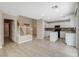 Open floorplan with white cabinets, center island and staircase to the second floor at 8307 Fort Hallock Ave, Las Vegas, NV 89131