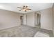 Relaxing main bedroom with carpeted floors, a ceiling fan, and an open doorway at 8307 Fort Hallock Ave, Las Vegas, NV 89131