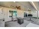 Enjoy this open-air patio with a fan, comfortable seating, and ample space for relaxation or outdoor dining at 8316 Maplestar Rd, Las Vegas, NV 89128