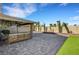 Enjoy a spacious backyard featuring a large patio, comfortable seating, and lush artificial grass at 8316 Maplestar Rd, Las Vegas, NV 89128