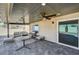 The expansive back patio has fans, stylish flooring, and ample seating for outdoor entertainment at 8316 Maplestar Rd, Las Vegas, NV 89128
