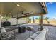 Host gatherings on the spacious patio with ceiling fans, outdoor seating, and space for a grill at 8316 Maplestar Rd, Las Vegas, NV 89128