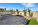 Expansive backyard showcasing a large paved patio and manicured landscaping at 8316 Maplestar Rd, Las Vegas, NV 89128