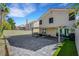 Beautiful backyard patio with pavers, covered seating area, and mature landscaping at 8316 Maplestar Rd, Las Vegas, NV 89128