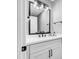 This bathroom has a large mirror with vanity lights and a white sink at 8316 Maplestar Rd, Las Vegas, NV 89128