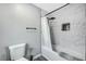 Bathroom with shower, tub, modern black fixtures, and tiled walls provide a luxurious bathing experience at 8316 Maplestar Rd, Las Vegas, NV 89128