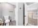 Cozy bathroom with toilet, shower and tub featuring modern fixtures and calming gray tones at 8316 Maplestar Rd, Las Vegas, NV 89128