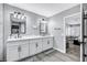 Stylish bathroom with a double vanity, sleek mirrors, and contemporary fixtures at 8316 Maplestar Rd, Las Vegas, NV 89128