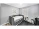 Neutral bedroom with a cozy twin bed and clean design aesthetic at 8316 Maplestar Rd, Las Vegas, NV 89128