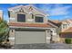 Attractive two-story home featuring a tile roof, neutral stucco, and a spacious garage at 8316 Maplestar Rd, Las Vegas, NV 89128