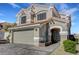 Beautiful two-story home featuring a tile roof, neutral stucco, and a two car garage at 8316 Maplestar Rd, Las Vegas, NV 89128