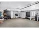 Spacious garage with epoxy floors, custom cabinets, and slat wall, offering ample storage and organization at 8316 Maplestar Rd, Las Vegas, NV 89128