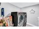 Laundry room with side-by-side washer and dryer and storage space at 8316 Maplestar Rd, Las Vegas, NV 89128