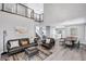Bright living room with modern gray flooring, high ceilings and modern furnishings at 8316 Maplestar Rd, Las Vegas, NV 89128