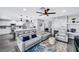 Open-concept living space connecting kitchen, with cozy seating and modern decor at 8316 Maplestar Rd, Las Vegas, NV 89128