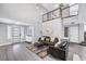 Stylish living room with gray flooring, high ceilings, and modern furnishings at 8316 Maplestar Rd, Las Vegas, NV 89128