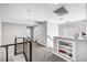 Upstairs landing featuring gray carpet, modern railings, and a built-in display case at 8316 Maplestar Rd, Las Vegas, NV 89128